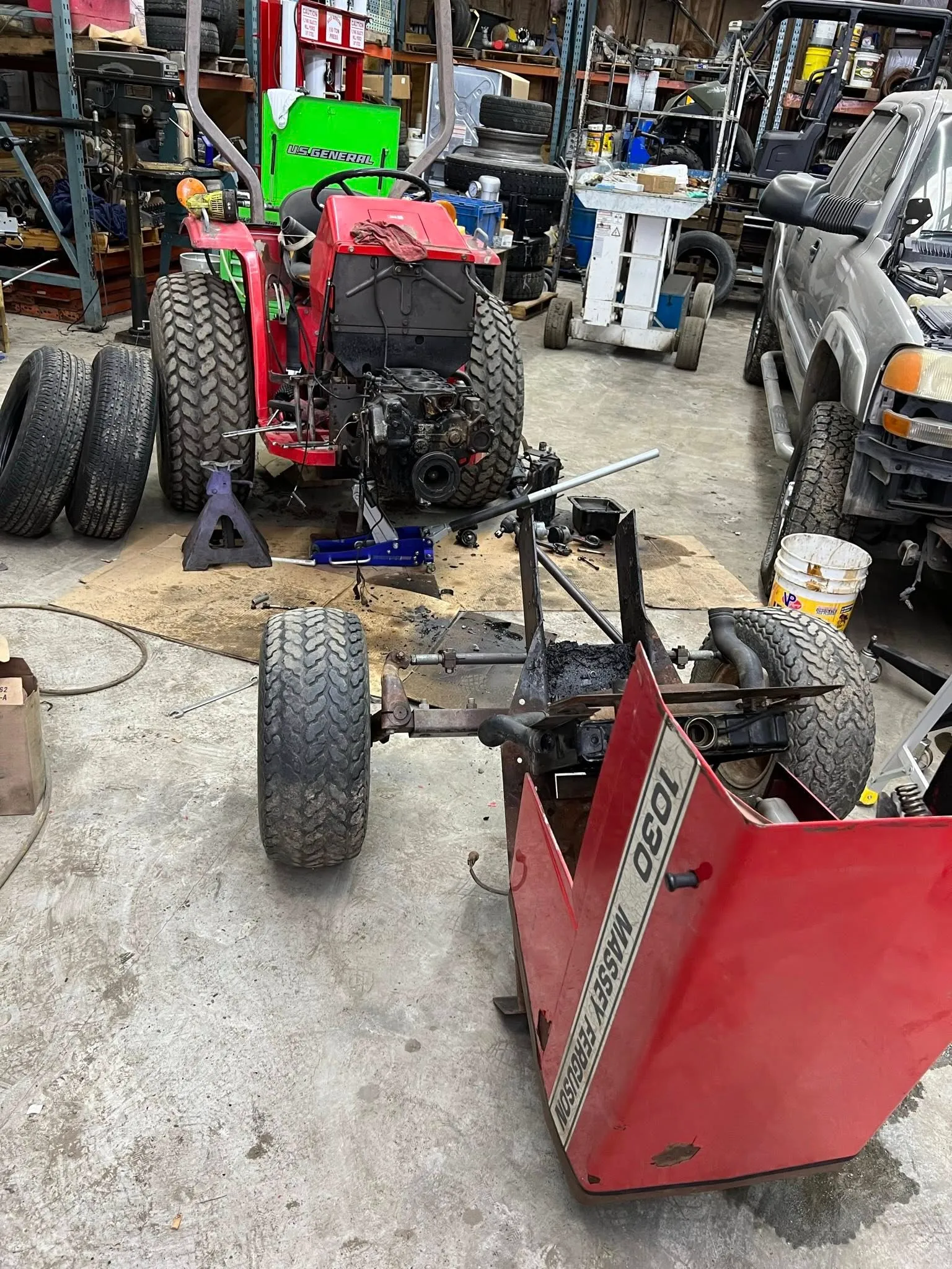 Massey Ferguson compact tractor split down for repair